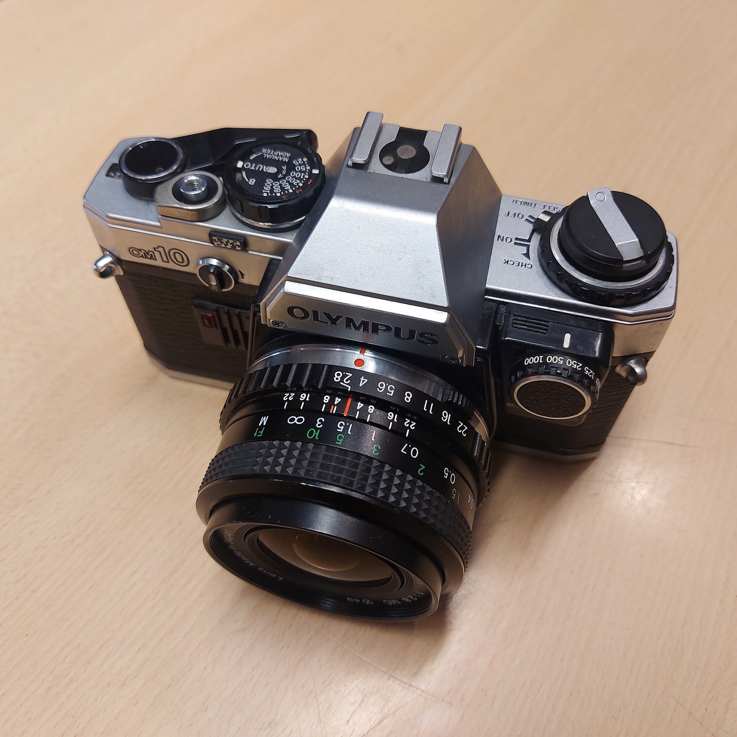 Olympus OM-10 + 28mm f/2.8 Miranda +manual adapter